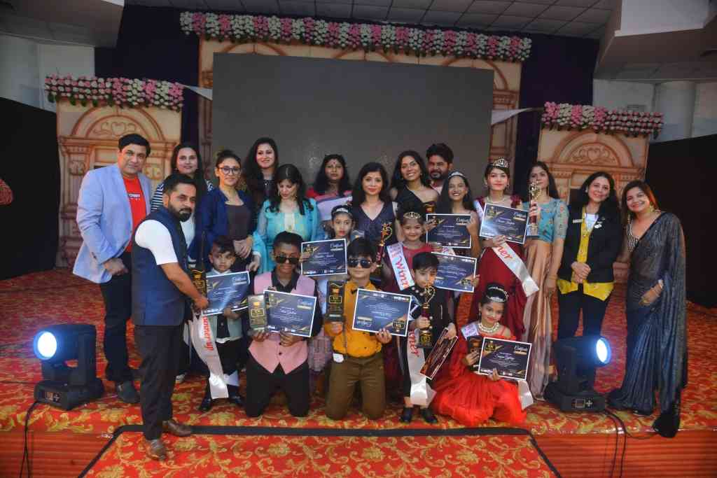 Winners and runners-up of the fashion contest along with the jury and organisers 