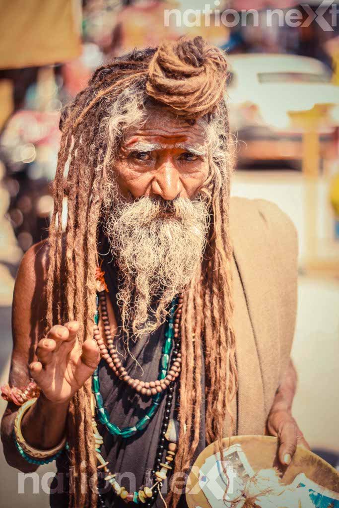 A sage poses for the photographer at Rishikesh