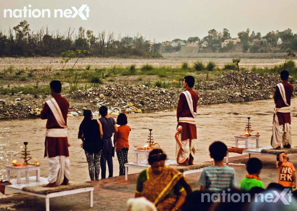 Priests and devotees carry out the Ganga Aarti at Triveni Ghat at Rishikesh