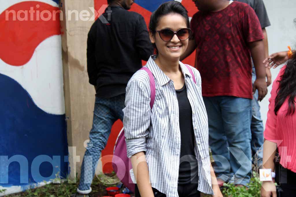 Archita Zawar, a student of LAD College at Graffiti Wall, a wall designing programme organized at IIID Design Yatra