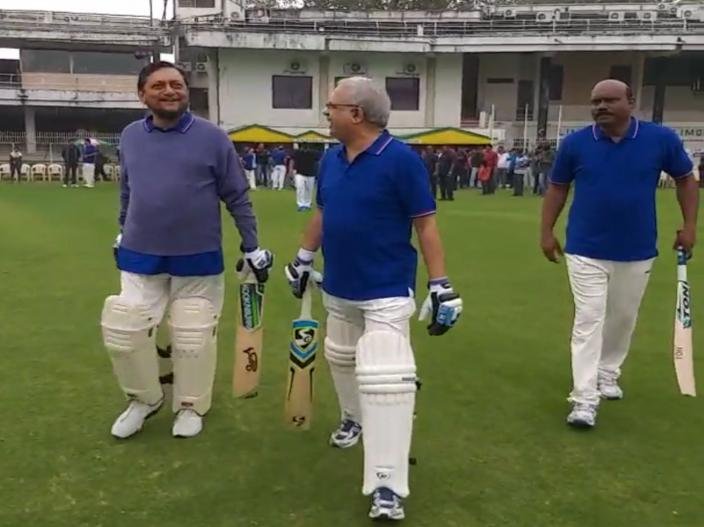 CJI Sharad Bobde heads towards the ground to bat during a match between Judges XI and HCBA President XI held at VCA Stadium in Civil Lines in Nagpur.