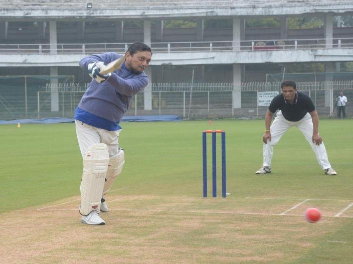 CJI Sharad Bobde smashes a delivery during a match between Judges XI and HCBA President XI held at VCA Stadium in Civil Lines in Nagpur.